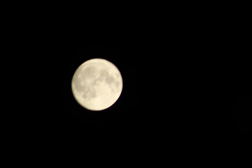 A photograph of the moon against a dark night sky